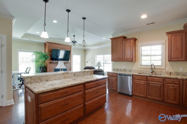 kitchen with pendant lighting, a healthy amount of sunlight, stainless steel dishwasher, and sink