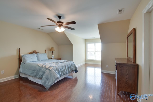 bedroom with hardwood / wood-style floors, ceiling fan, and vaulted ceiling