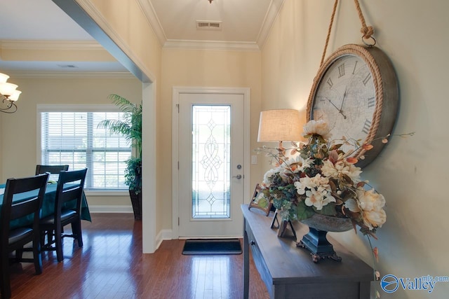 foyer entrance featuring dark hardwood / wood-style floors and ornamental molding