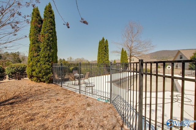 view of gate featuring a mountain view