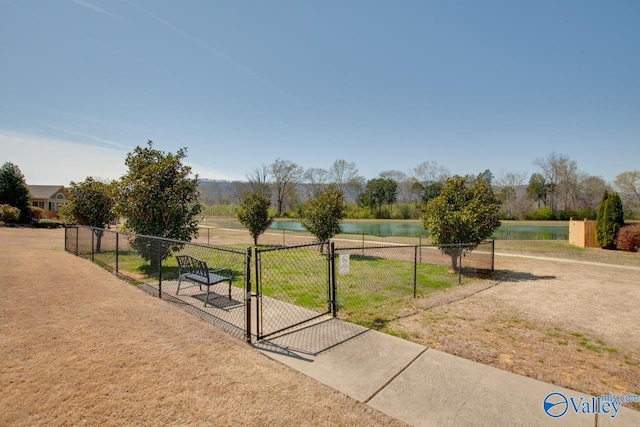 surrounding community featuring a water view