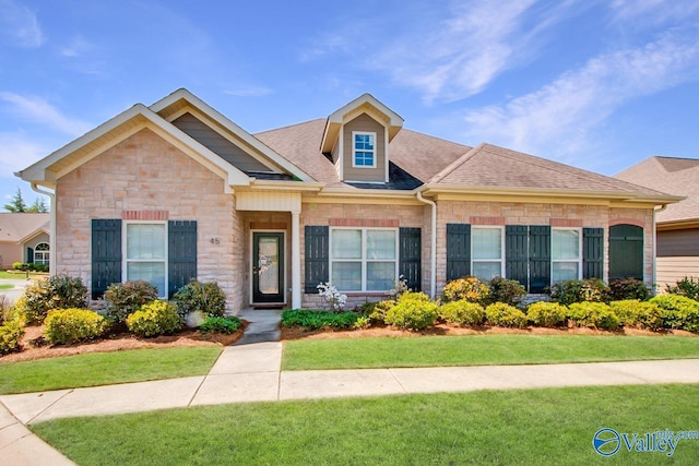 view of front of home with a front yard