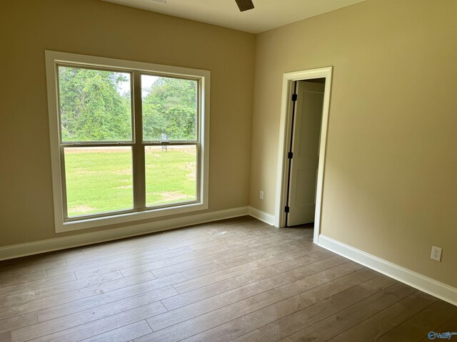 1112 Mountainview Rd NE, Hartselle, AL 35640 - spare room featuring plenty of natural light, dark wood-style flooring, and baseboards