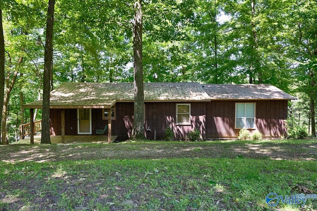 rear view of house with a lawn