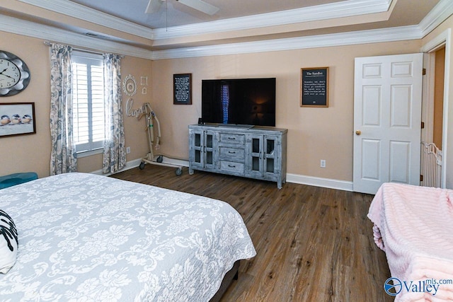 bedroom featuring ornamental molding, dark wood-style flooring, a ceiling fan, and baseboards