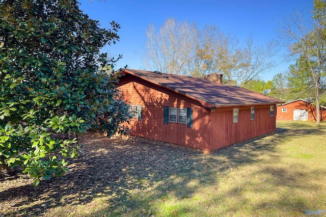 view of home's exterior featuring a lawn