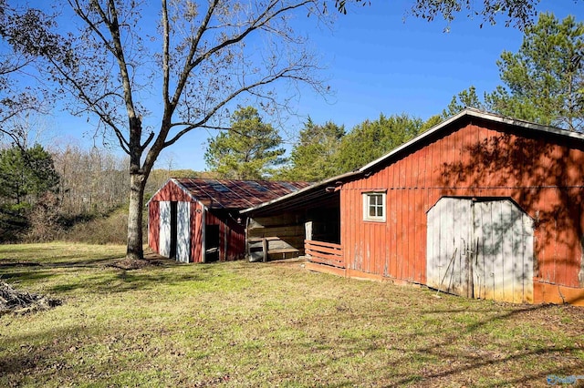 view of outdoor structure with a yard