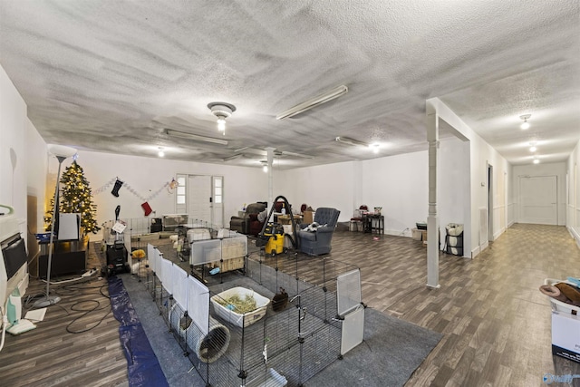 interior space featuring dark hardwood / wood-style flooring and a textured ceiling