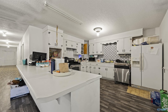 kitchen featuring tasteful backsplash, kitchen peninsula, white cabinetry, appliances with stainless steel finishes, and a textured ceiling