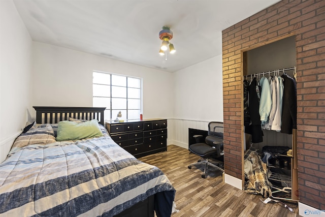 bedroom featuring a closet and hardwood / wood-style flooring