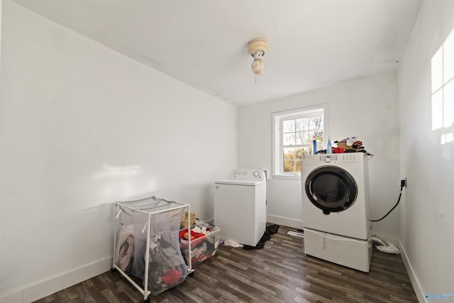 clothes washing area featuring dark hardwood / wood-style flooring and independent washer and dryer