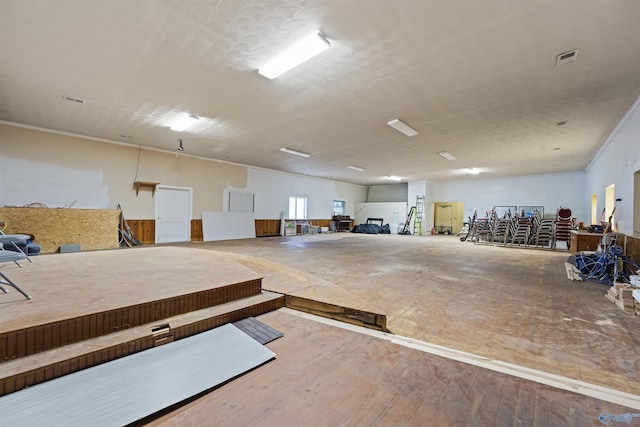 misc room featuring hardwood / wood-style floors and crown molding