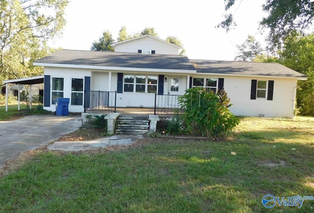 view of front of property with a front yard and a carport