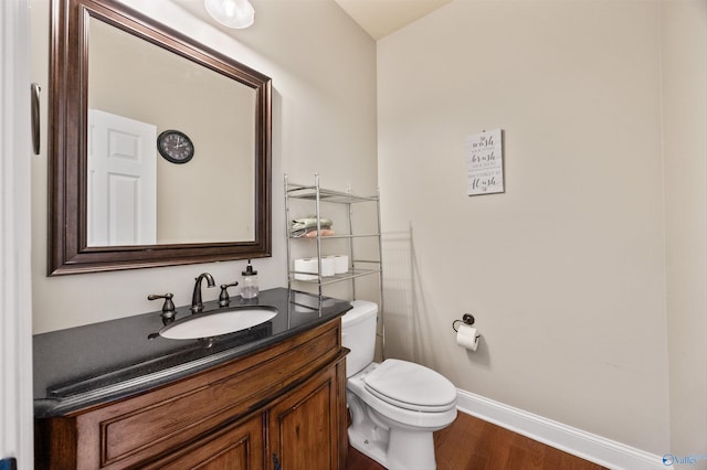 8 Cypress Point Dr, Huntsville, AL 35824 - bathroom with wood finished floors, vanity, baseboards, and toilet