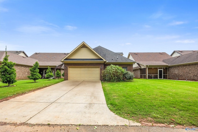 8 Cypress Point Dr, Huntsville, AL 35824 - view of front of home featuring concrete driveway, an attached garage, a sunroom, a front lawn, and brick siding