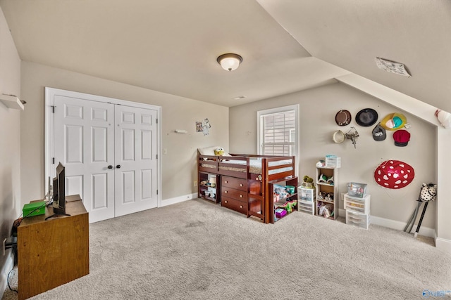 8 Cypress Point Dr, Huntsville, AL 35824 - carpeted bedroom with vaulted ceiling, baseboards, and a closet