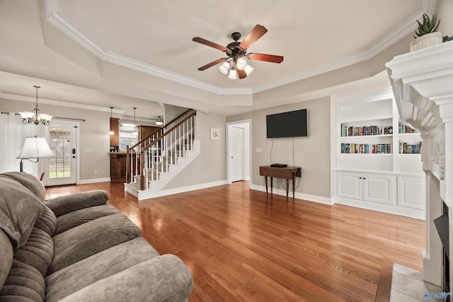 8 Cypress Point Dr, Huntsville, AL 35824 - living room with stairway, a raised ceiling, crown molding, light wood-style flooring, and a ceiling fan