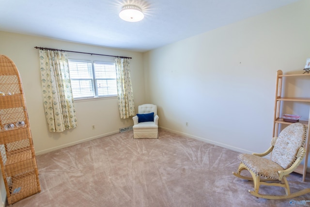 unfurnished room with carpet floors, baseboards, and visible vents