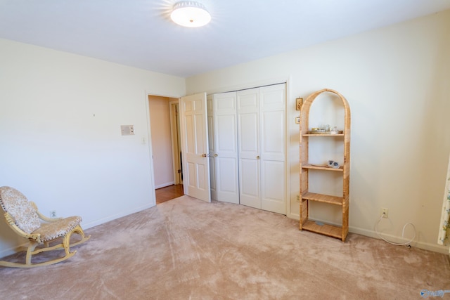 unfurnished room with carpet flooring and baseboards