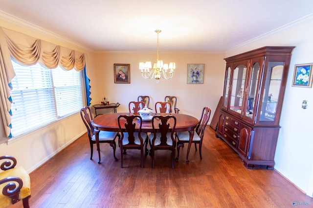 dining area with ornamental molding, a notable chandelier, dark wood finished floors, and baseboards