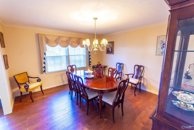 dining room featuring dark wood-style floors, crown molding, baseboards, and a notable chandelier