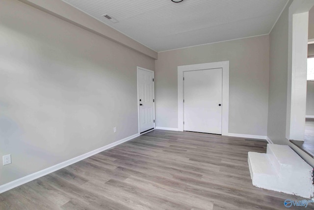 unfurnished room with light hardwood / wood-style flooring