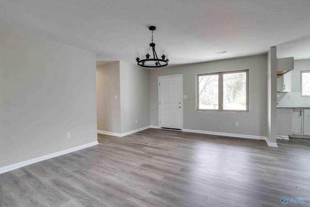 interior space featuring a chandelier and light wood-type flooring