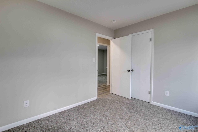 unfurnished bedroom featuring carpet