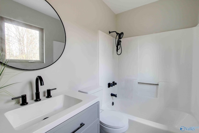 full bathroom with vanity, shower / bathtub combination, and toilet