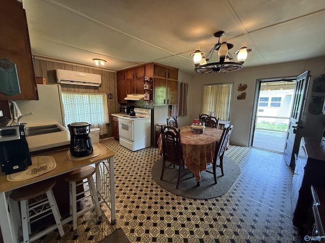 4094 County Road 66, Section, AL 35771 - dining room with a wall mounted air conditioner, a chandelier, and light floors