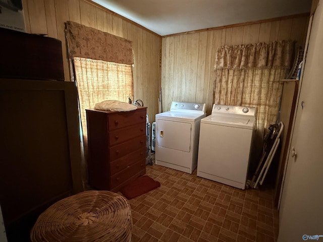4094 County Road 66, Section, AL 35771 - laundry room featuring wooden walls, washer and dryer, and brick patterned floors