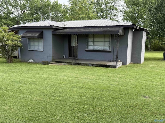 4094 County Road 66, Section, AL 35771 - view of front facade featuring concrete block siding, a front lawn, and metal roof