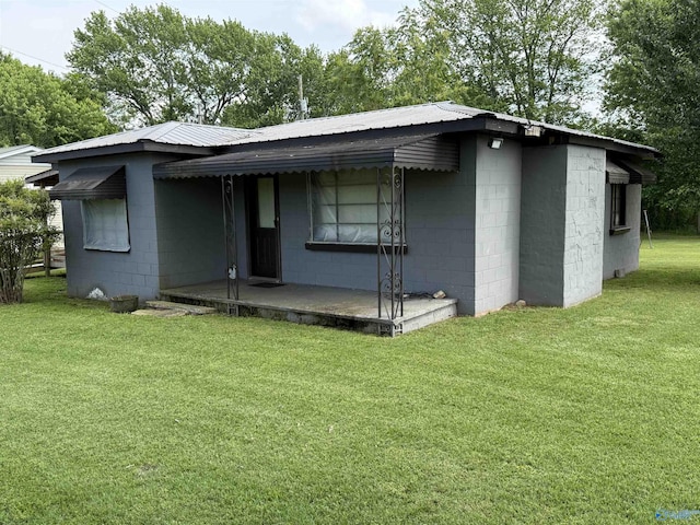 4094 County Road 66, Section, AL 35771 - view of front facade with concrete block siding, a front lawn, and metal roof