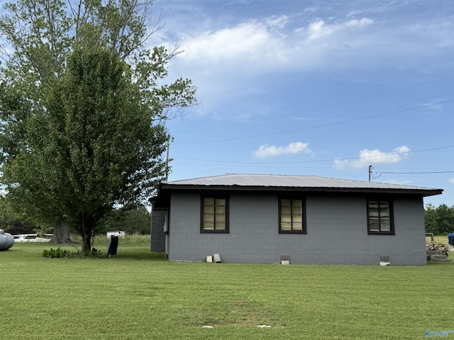 4094 County Road 66, Section, AL 35771 - view of home's exterior with concrete block siding and a lawn