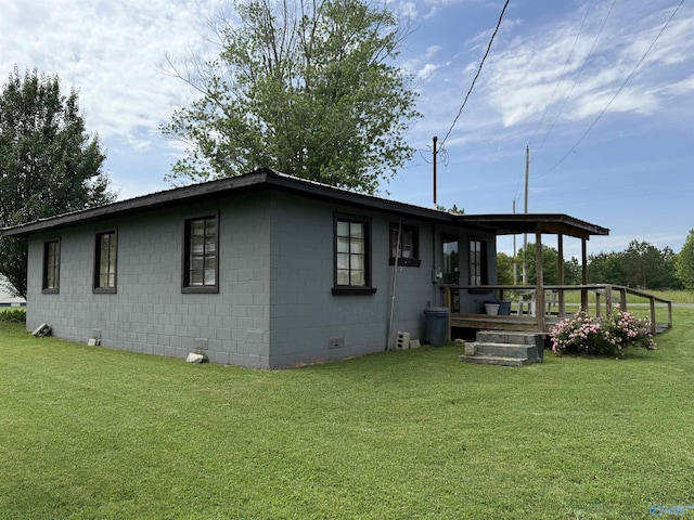 4094 County Road 66, Section, AL 35771 - view of side of property featuring a yard, concrete block siding, and a wooden deck