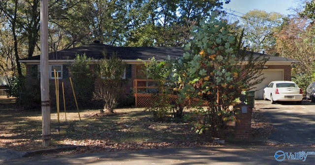 3411 Euclid Dr NW, Huntsville, AL 35810 - obstructed view of property featuring an attached garage and driveway