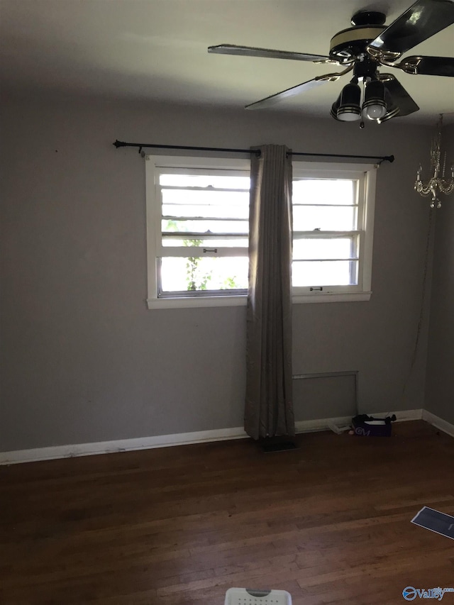 3411 Euclid Dr NW, Huntsville, AL 35810 - spare room featuring ceiling fan, healthy amount of natural light, wood finished floors, and baseboards