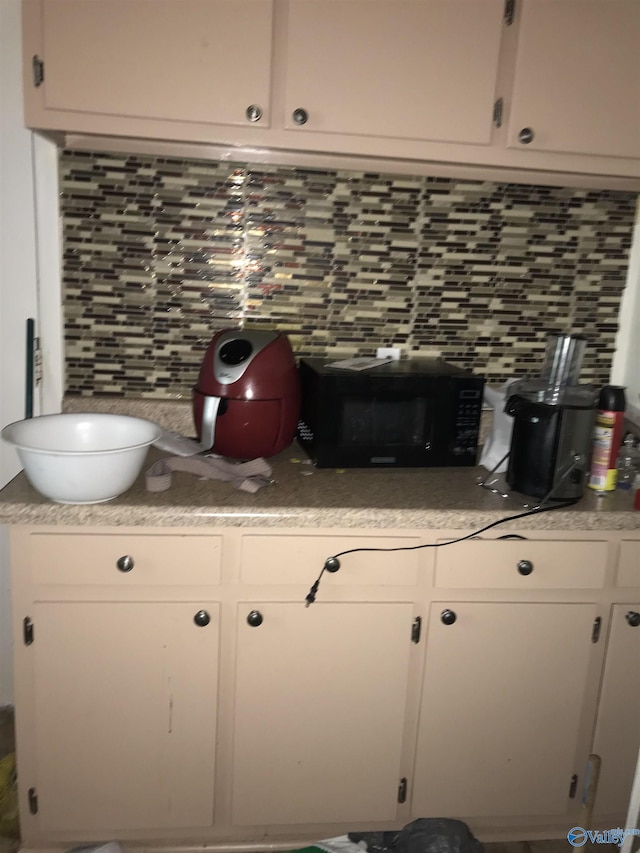 3411 Euclid Dr NW, Huntsville, AL 35810 - detailed view of tasteful backsplash and black microwave