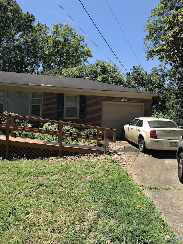 3411 Euclid Dr NW, Huntsville, AL 35810 - ranch-style home featuring brick siding, an attached garage, driveway, and a front yard