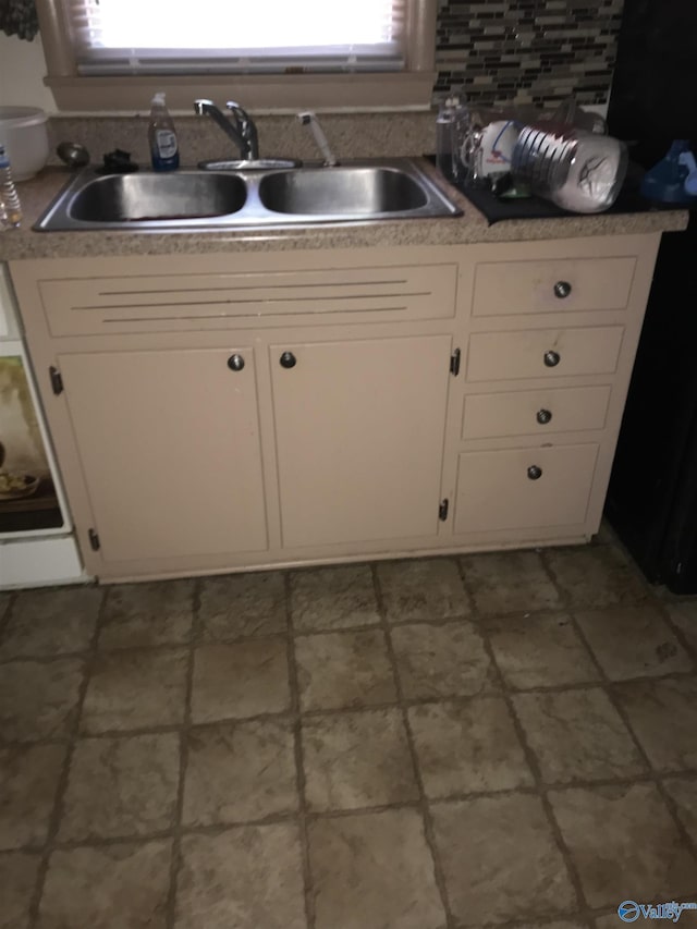 3411 Euclid Dr NW, Huntsville, AL 35810 - kitchen featuring a sink, white cabinets, and light countertops