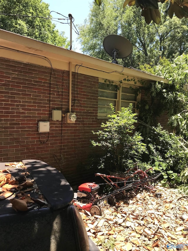 3411 Euclid Dr NW, Huntsville, AL 35810 - exterior view of brick siding, a satellite dish, and electric meter