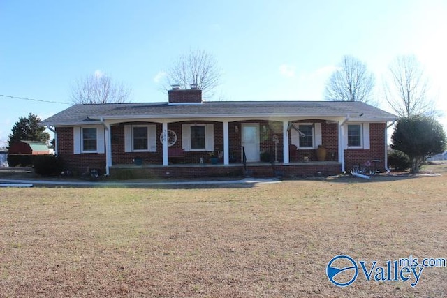 single story home with a porch and a front lawn