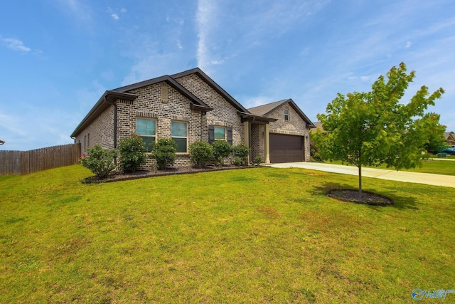 13971 Lannister Ln, Athens, AL 35613 - view of front facade with driveway, brick siding, and a garage