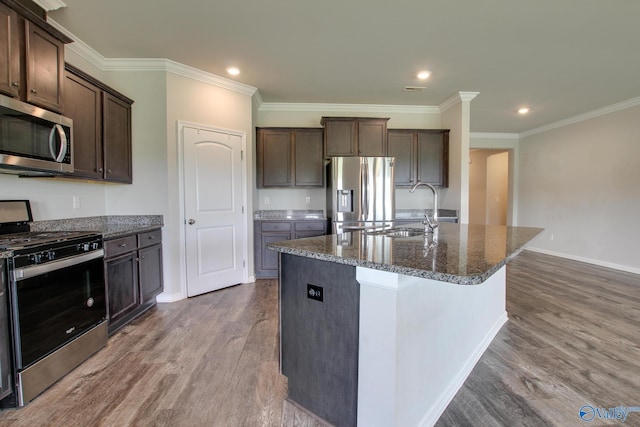 13971 Lannister Ln, Athens, AL 35613 - kitchen with stainless steel appliances, dark wood finished floors, dark brown cabinets, dark stone countertops, and a sink