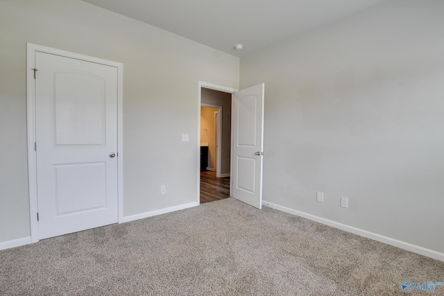 13971 Lannister Ln, Athens, AL 35613 - unfurnished bedroom featuring carpet and baseboards