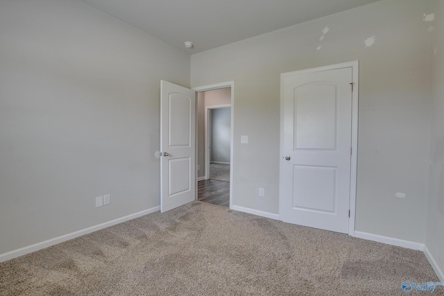13971 Lannister Ln, Athens, AL 35613 - unfurnished bedroom with carpet and baseboards