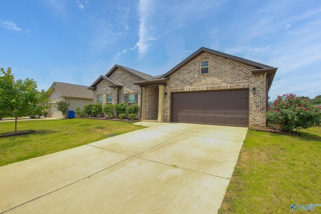 13971 Lannister Ln, Athens, AL 35613 - traditional-style house with brick siding, a front lawn, concrete driveway, and an attached garage