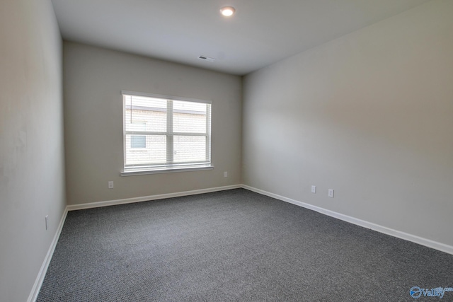13971 Lannister Ln, Athens, AL 35613 - unfurnished room with dark carpet and baseboards