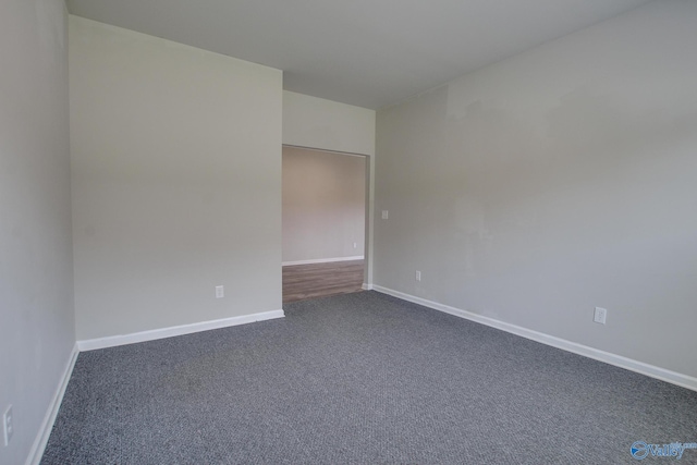 13971 Lannister Ln, Athens, AL 35613 - unfurnished room featuring dark colored carpet and baseboards