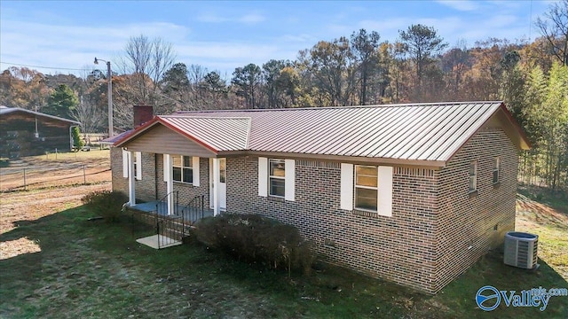 view of front facade featuring central AC unit